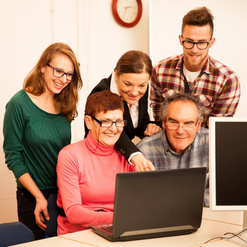 Group of Adults Learning Computer Skills 